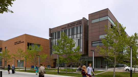 Students walking on University of Windsor campus outside of the Dr. Murray O'Neil Medical Education Centre